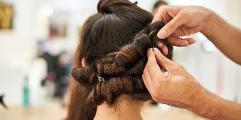 brunette hair getting pinned up in curls
