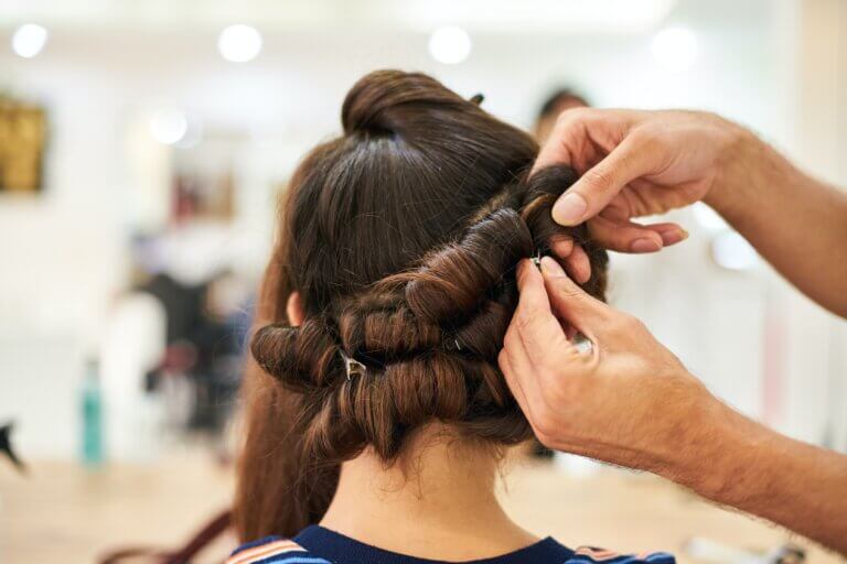 pinning brown hair into curls